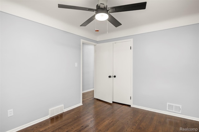 24270 Scotia Rd, Oak Park, MI 48237 - unfurnished bedroom with dark wood finished floors, a closet, and a ceiling fan