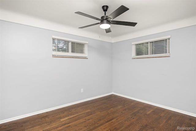 24270 Scotia Rd, Oak Park, MI 48237 - empty room featuring dark wood finished floors and ceiling fan
