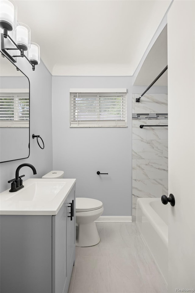 24270 Scotia Rd, Oak Park, MI 48237 - full bath with marble finish flooring, vanity, plenty of natural light, and tub / shower combination