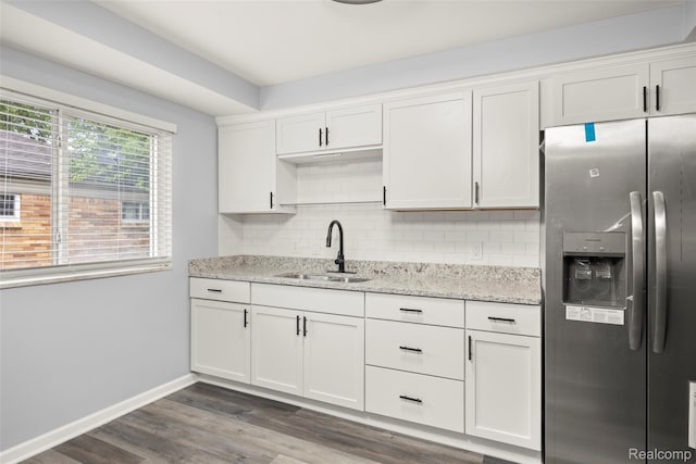 24270 Scotia Rd, Oak Park, MI 48237 - kitchen featuring stainless steel refrigerator with ice dispenser, backsplash, white cabinetry, and dark wood finished floors