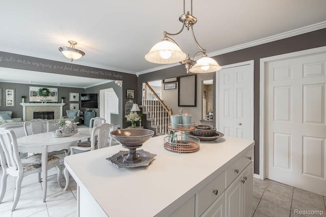 4500 Red Oak Blvd, Waterford, MI 48329 - kitchen featuring crown molding, a fireplace, a kitchen island, pendant lighting, and white cabinets