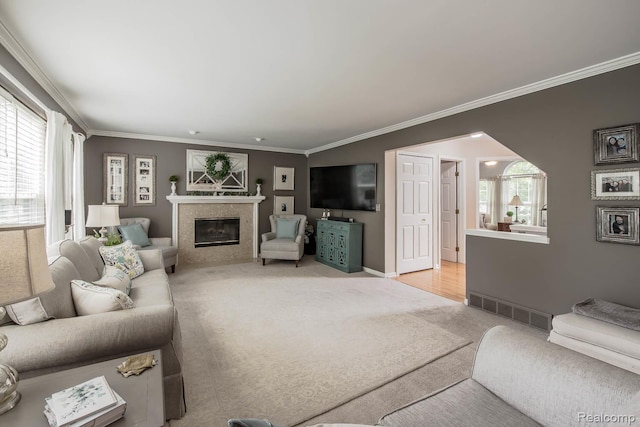 4500 Red Oak Blvd, Waterford, MI 48329 - living area with light carpet, ornamental molding, healthy amount of natural light, and a fireplace