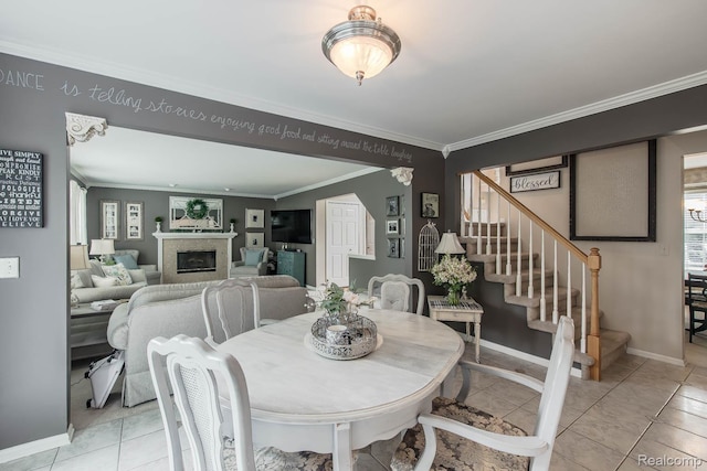 4500 Red Oak Blvd, Waterford, MI 48329 - dining area featuring crown molding, stairs, and a glass covered fireplace