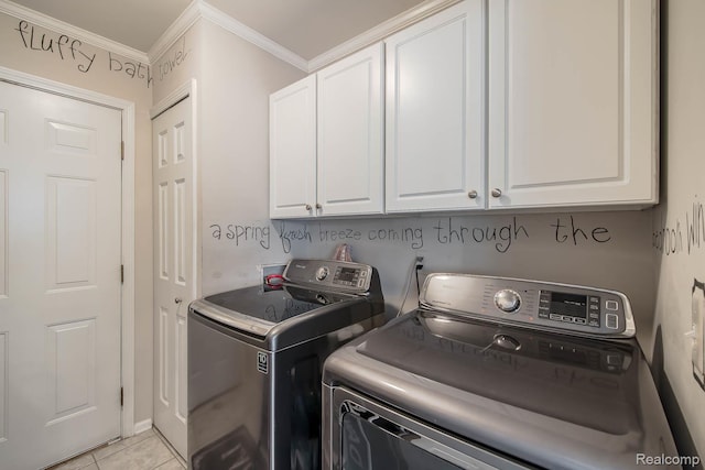 4500 Red Oak Blvd, Waterford, MI 48329 - washroom featuring cabinet space, washer and clothes dryer, ornamental molding, and light tile patterned floors