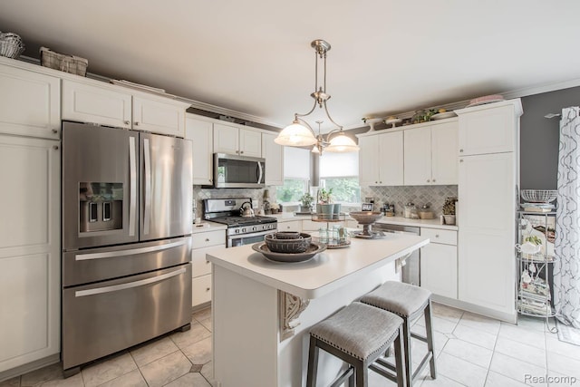 4500 Red Oak Blvd, Waterford, MI 48329 - kitchen with appliances with stainless steel finishes, light countertops, white cabinets, and ornamental molding