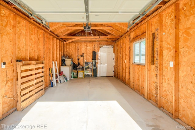 166 Indian Trl, Columbiaville, MI 48421 - garage featuring a garage door opener