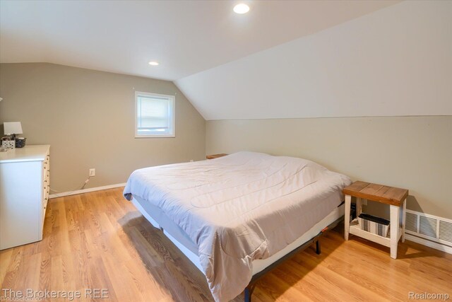 166 Indian Trl, Columbiaville, MI 48421 - bedroom featuring light wood-style flooring, lofted ceiling, and recessed lighting