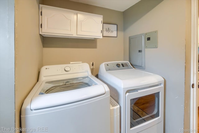 166 Indian Trl, Columbiaville, MI 48421 - washroom with cabinet space, washer and clothes dryer, and electric panel