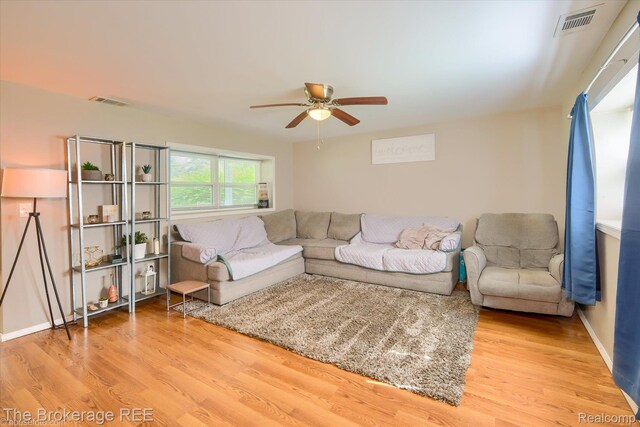 166 Indian Trl, Columbiaville, MI 48421 - living room featuring a ceiling fan and wood finished floors