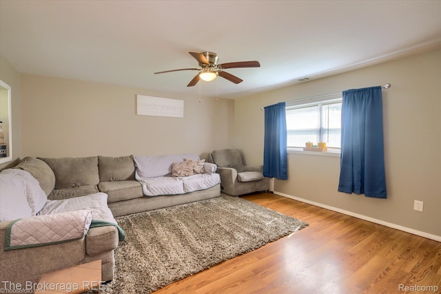 166 Indian Trl, Columbiaville, MI 48421 - living room featuring a ceiling fan and wood finished floors