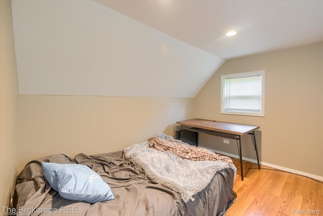 166 Indian Trl, Columbiaville, MI 48421 - bedroom with lofted ceiling, wood finished floors, and recessed lighting