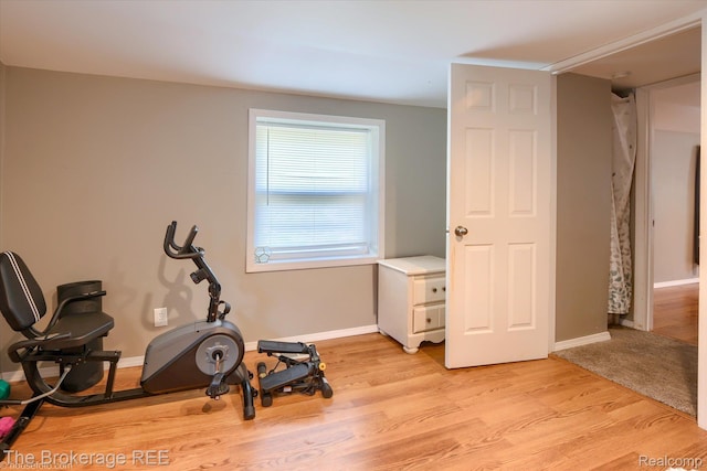 166 Indian Trl, Columbiaville, MI 48421 - workout area featuring light wood-style floors and baseboards
