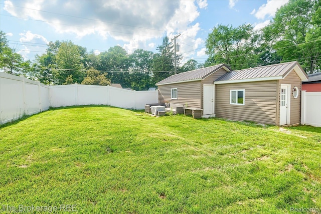 166 Indian Trl, Columbiaville, MI 48421 - fenced backyard featuring an outdoor structure