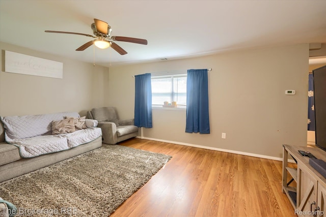 166 Indian Trl, Columbiaville, MI 48421 - living area featuring ceiling fan and light wood-type flooring