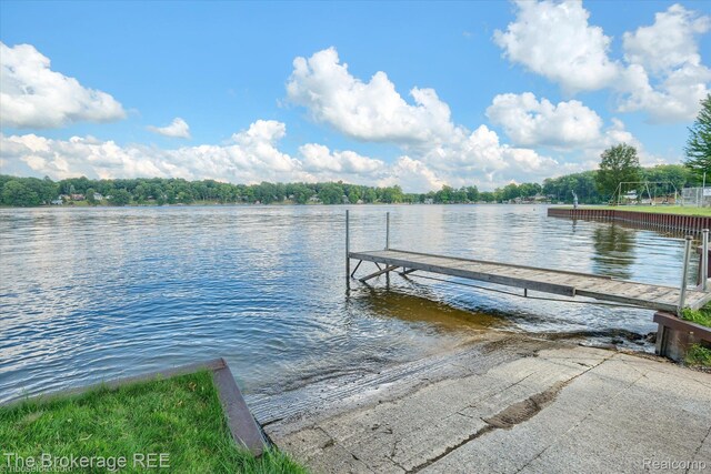 166 Indian Trl, Columbiaville, MI 48421 - dock area featuring a boat ramp and a water view