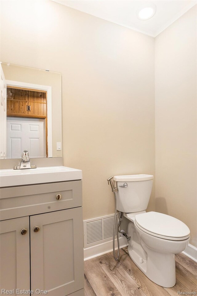 3408 Ardmore Dr, Troy, MI 48083 - bathroom with wood finished floors and vanity