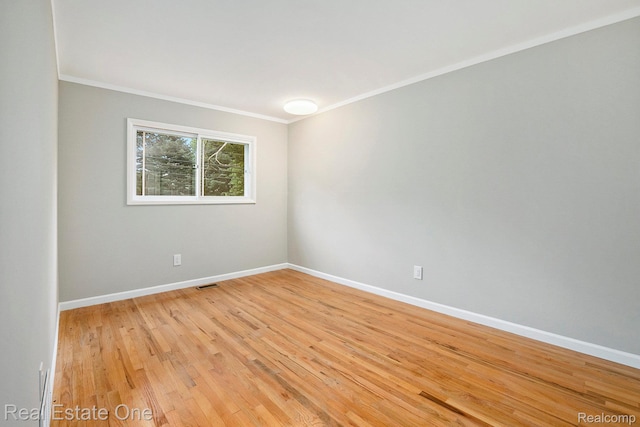 3408 Ardmore Dr, Troy, MI 48083 - spare room featuring ornamental molding and light wood finished floors