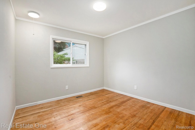 3408 Ardmore Dr, Troy, MI 48083 - empty room featuring ornamental molding and light wood-style flooring
