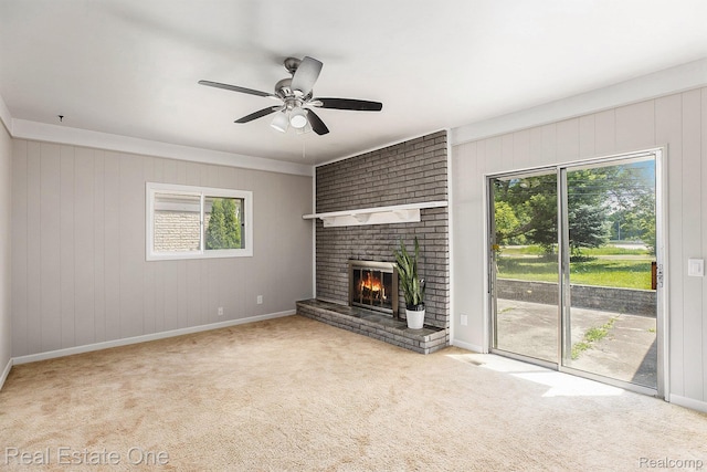 3408 Ardmore Dr, Troy, MI 48083 - unfurnished living room with healthy amount of natural light, carpet floors, a brick fireplace, a ceiling fan, and wooden walls