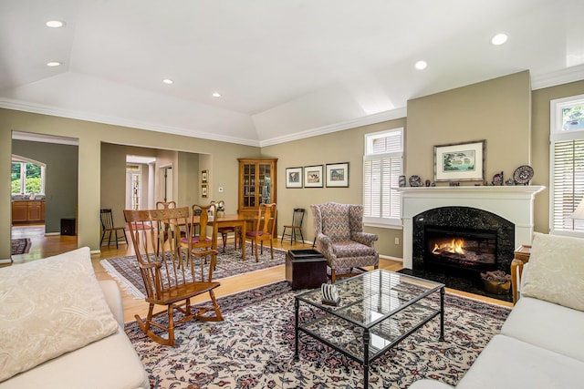 2736 Aspen Ct, Ann Arbor, MI 48108 - living room featuring light wood-style flooring, ornamental molding, a fireplace, recessed lighting, and vaulted ceiling