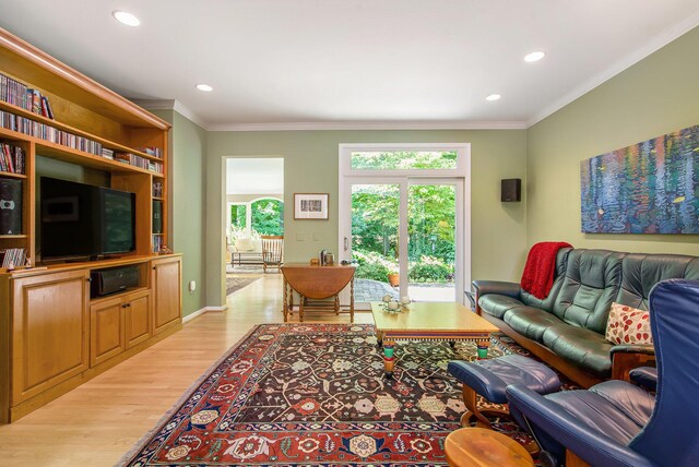 2736 Aspen Ct, Ann Arbor, MI 48108 - living room with healthy amount of natural light, wood finished floors, recessed lighting, and ornamental molding