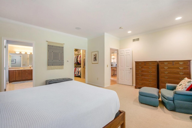2736 Aspen Ct, Ann Arbor, MI 48108 - bedroom featuring crown molding, a walk in closet, recessed lighting, ensuite bath, and light carpet