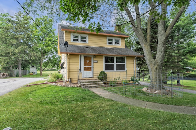 2050 S Wagner Rd, Ann Arbor, MI 48103 - view of front of home featuring a chimney and asphalt driveway