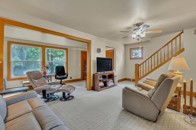 2050 S Wagner Rd, Ann Arbor, MI 48103 - living area featuring light carpet, ceiling fan, healthy amount of natural light, and stairs