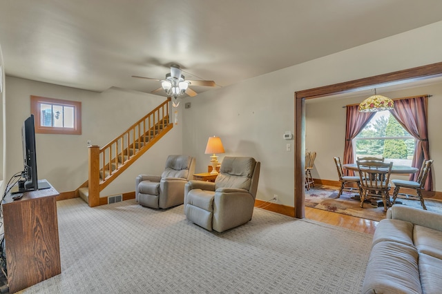 2050 S Wagner Rd, Ann Arbor, MI 48103 - living room with stairs, ceiling fan, and wood finished floors