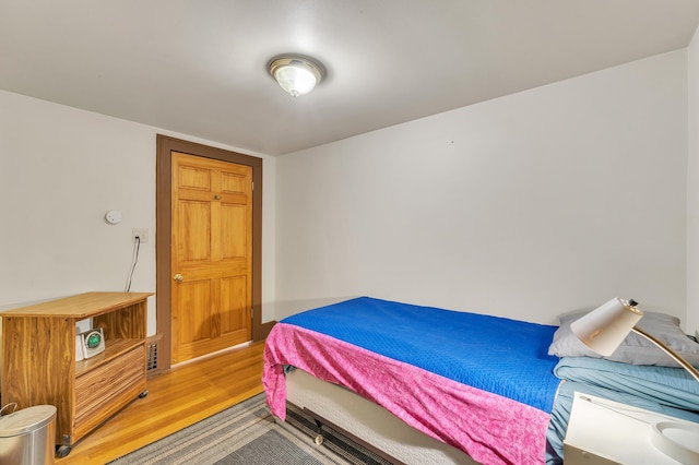 2050 S Wagner Rd, Ann Arbor, MI 48103 - bedroom with light wood-style flooring