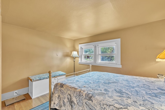 2050 S Wagner Rd, Ann Arbor, MI 48103 - bedroom with wood finished floors and baseboards