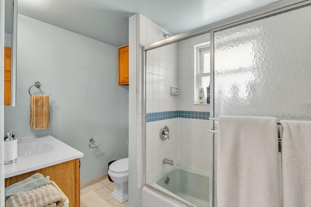 2050 S Wagner Rd, Ann Arbor, MI 48103 - bathroom with vanity, tile patterned flooring, and bath / shower combo with glass door