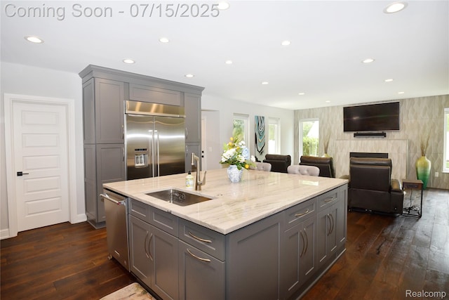 591 Wallace St, Birmingham, MI 48009 - kitchen with appliances with stainless steel finishes, gray cabinets, dark wood finished floors, light stone countertops, and recessed lighting