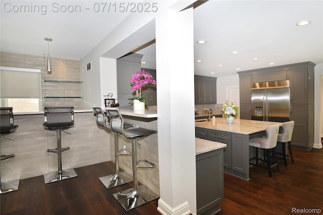 591 Wallace St, Birmingham, MI 48009 - kitchen featuring stainless steel built in fridge, a kitchen breakfast bar, dark wood-type flooring, recessed lighting, and gray cabinets
