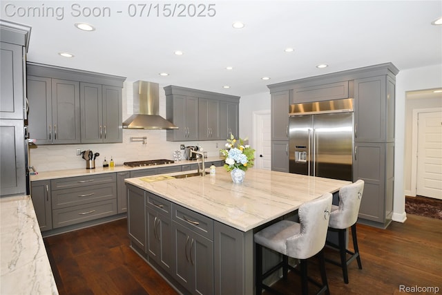 591 Wallace St, Birmingham, MI 48009 - kitchen featuring wall chimney range hood, stainless steel appliances, recessed lighting, light stone counters, and gray cabinets