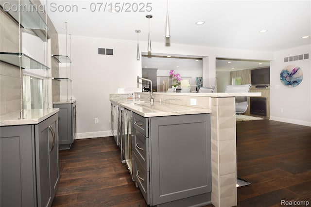 591 Wallace St, Birmingham, MI 48009 - kitchen featuring gray cabinetry, a peninsula, dark wood-style floors, light stone counters, and recessed lighting
