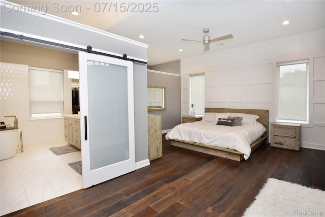 591 Wallace St, Birmingham, MI 48009 - bedroom with hardwood / wood-style floors, a barn door, recessed lighting, a decorative wall, and a ceiling fan