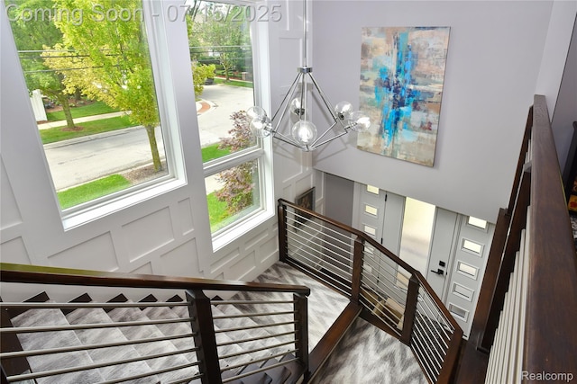 591 Wallace St, Birmingham, MI 48009 - staircase with a chandelier and wood finished floors