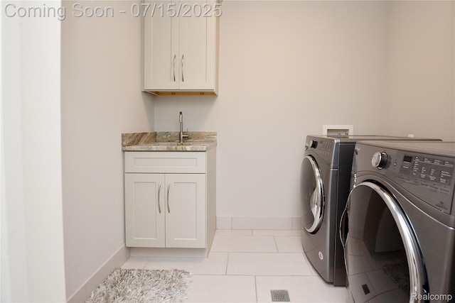 591 Wallace St, Birmingham, MI 48009 - laundry room with separate washer and dryer, cabinet space, and light tile patterned flooring