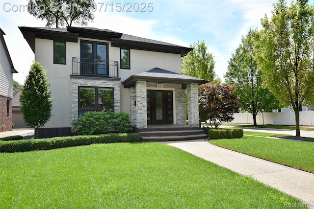 591 Wallace St, Birmingham, MI 48009 - view of front of property with a balcony, stone siding, french doors, and stucco siding