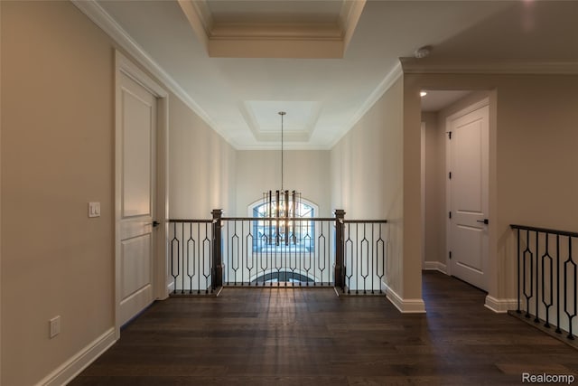 2599 Forest Glen Ct, Rochester, MI 48306 - hall featuring a chandelier, wood finished floors, a raised ceiling, an upstairs landing, and crown molding
