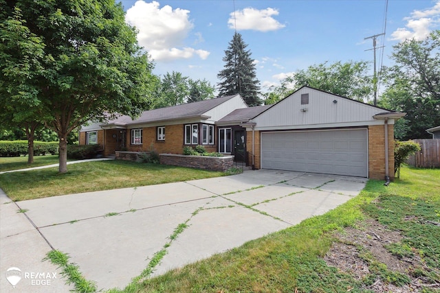 501 Lafayette St, Flint, MI 48503 - single story home featuring driveway, a garage, and brick siding