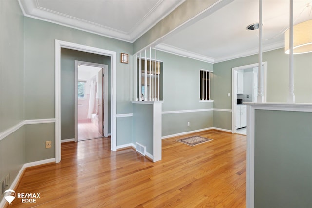 501 Lafayette St, Flint, MI 48503 - empty room with light wood finished floors and crown molding