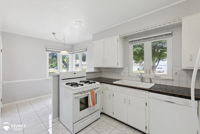 501 Lafayette St, Flint, MI 48503 - kitchen featuring white appliances, dark countertops, white cabinetry, and decorative backsplash