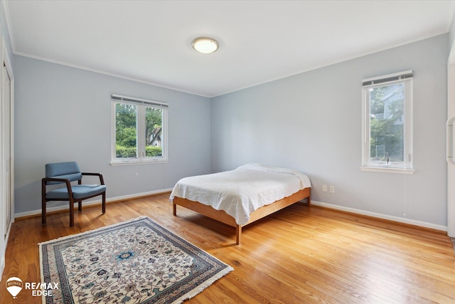501 Lafayette St, Flint, MI 48503 - bedroom with light wood-style flooring and ornamental molding