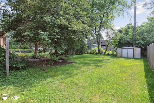 501 Lafayette St, Flint, MI 48503 - fenced backyard featuring a storage unit