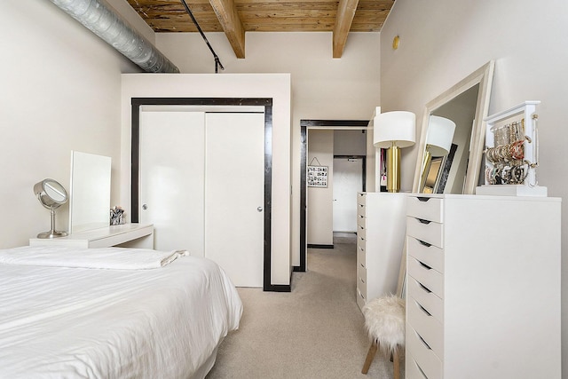 940 Monroe Ave NW Unit 416, Grand Rapids, MI 49503 - bedroom featuring light carpet, a wooden ceiling with exposed beams, and a closet