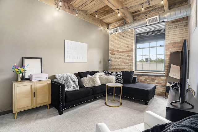 940 Monroe Ave NW Unit 416, Grand Rapids, MI 49503 - living area featuring rail lighting, a wood ceiling with exposed beams, carpet, and brick wall