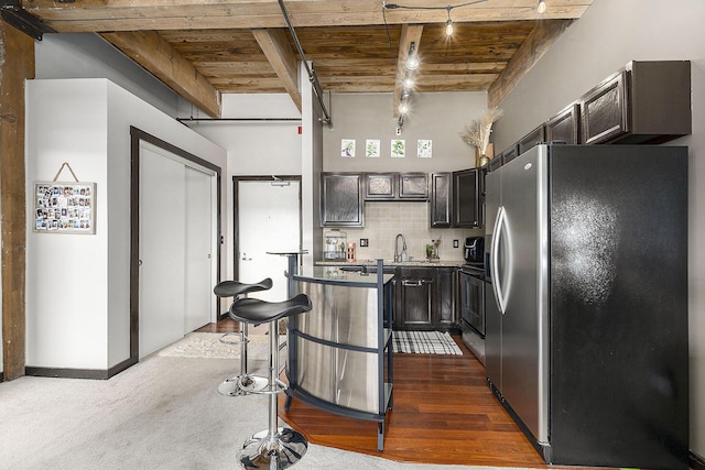 940 Monroe Ave NW Unit 416, Grand Rapids, MI 49503 - kitchen with stainless steel refrigerator with ice dispenser, a wooden ceiling with exposed beams, and backsplash