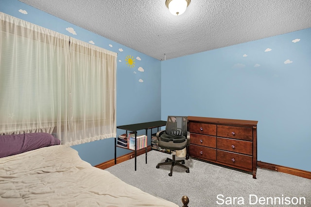 1026 Alan St, Fremont, MI 49412 - bedroom featuring a textured ceiling, carpet floors, and a desk